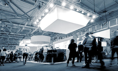 business-people-walking-trade-show-booths-public-event-exhibition-hall.jpg